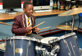 windsor olympus academy student playing the drums